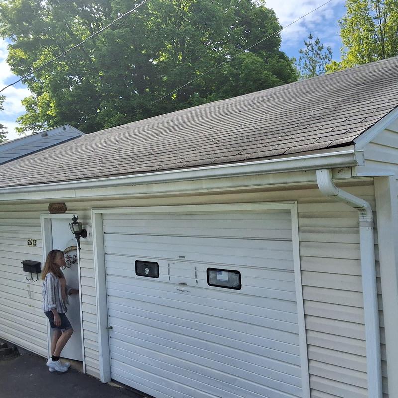 Asphalt shingled roof inspection on garage building