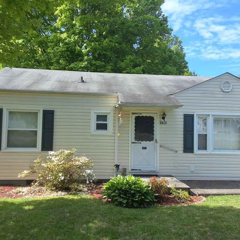 Shingled roof inspection on aged residential house