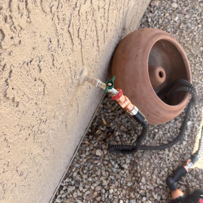 Outdoor hose bib with attached garden hose and valve Outdoor hose bib with attached garden hose and valve