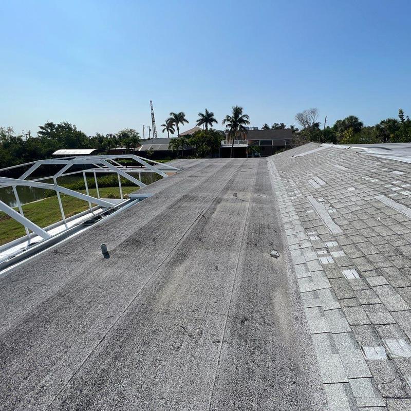 Shingle roof with storm damage and patch repairs