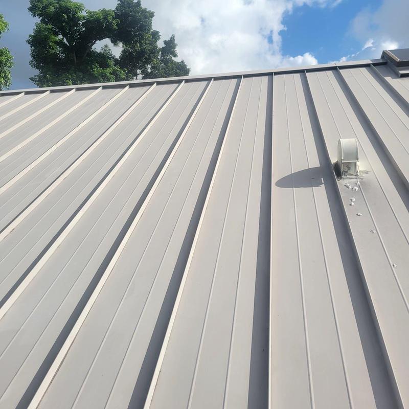 Standing seam metal roof with vent pipe installation