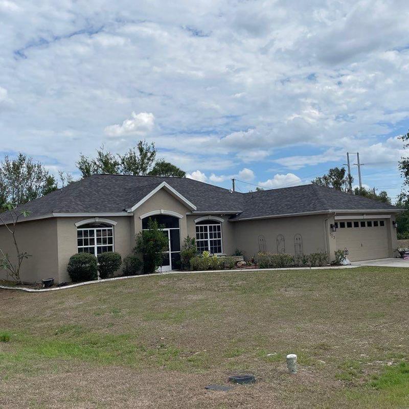 Shingle roof system on single-story home exterior