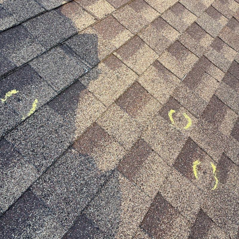 Asphalt shingles with hail damage marked for repair