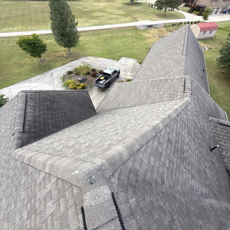 Asphalt shingle roof with hail damage inspection