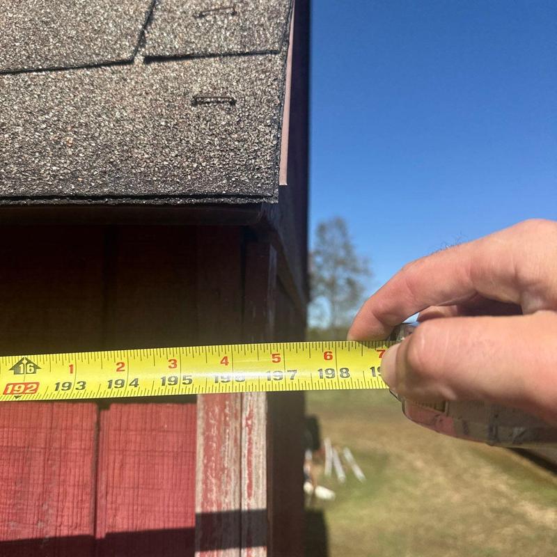 Roof shingle edge measurement with tape measure