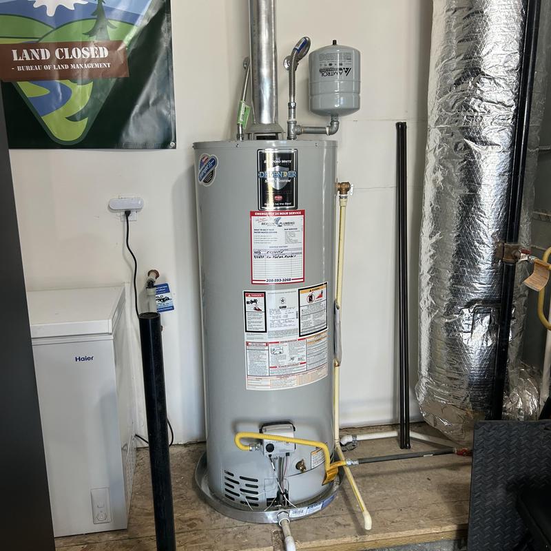 Water heater with expansion tank and gas line connections