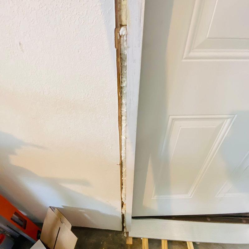 Exterior garage door frame with foam insulation installed
