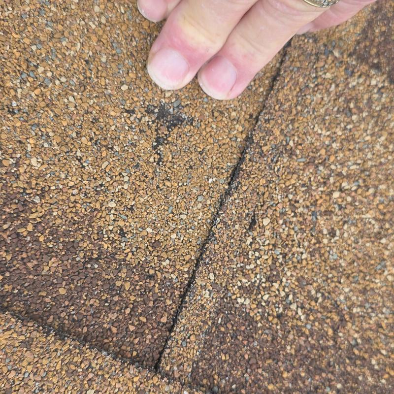 Asphalt shingle roof close-up showing hail damage detail