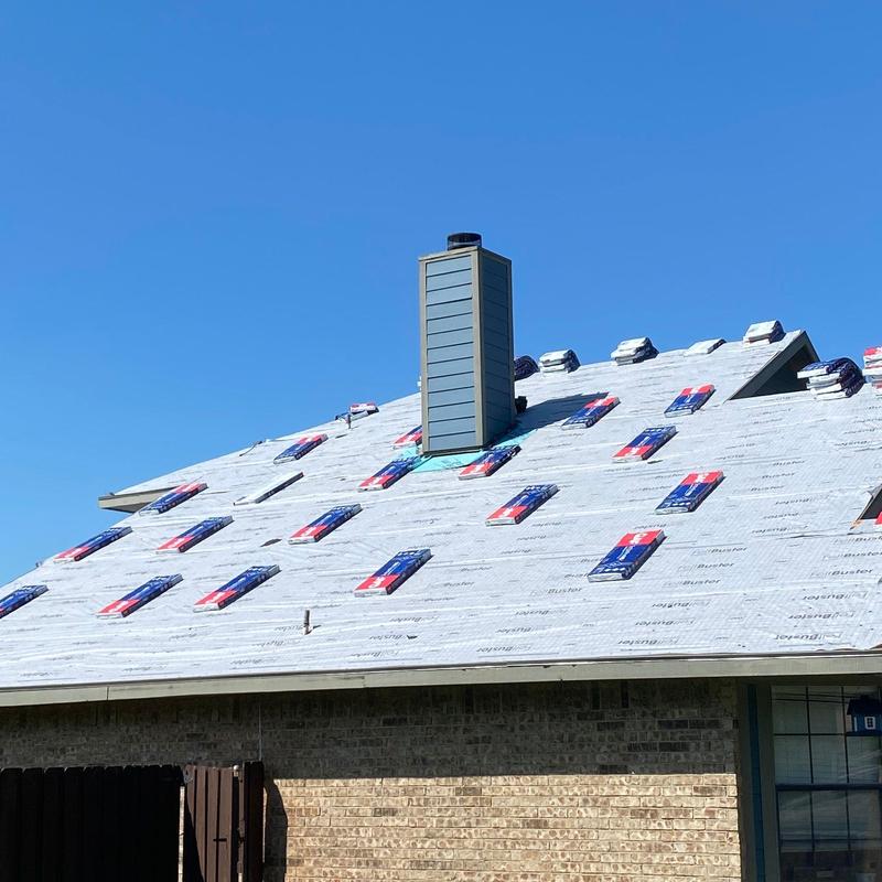 GAF Timberline HDZ roofing shingles staged for install