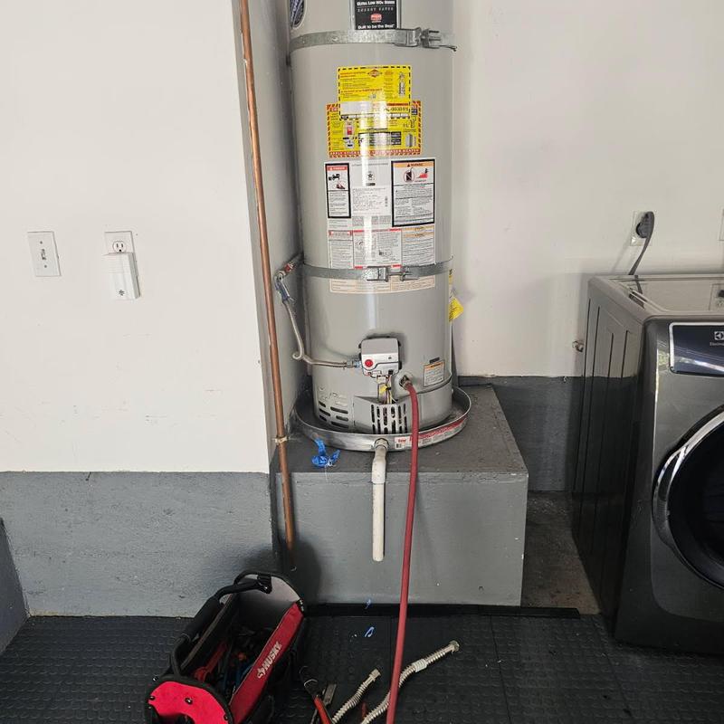 Water heater flexible connector replacement in laundry room