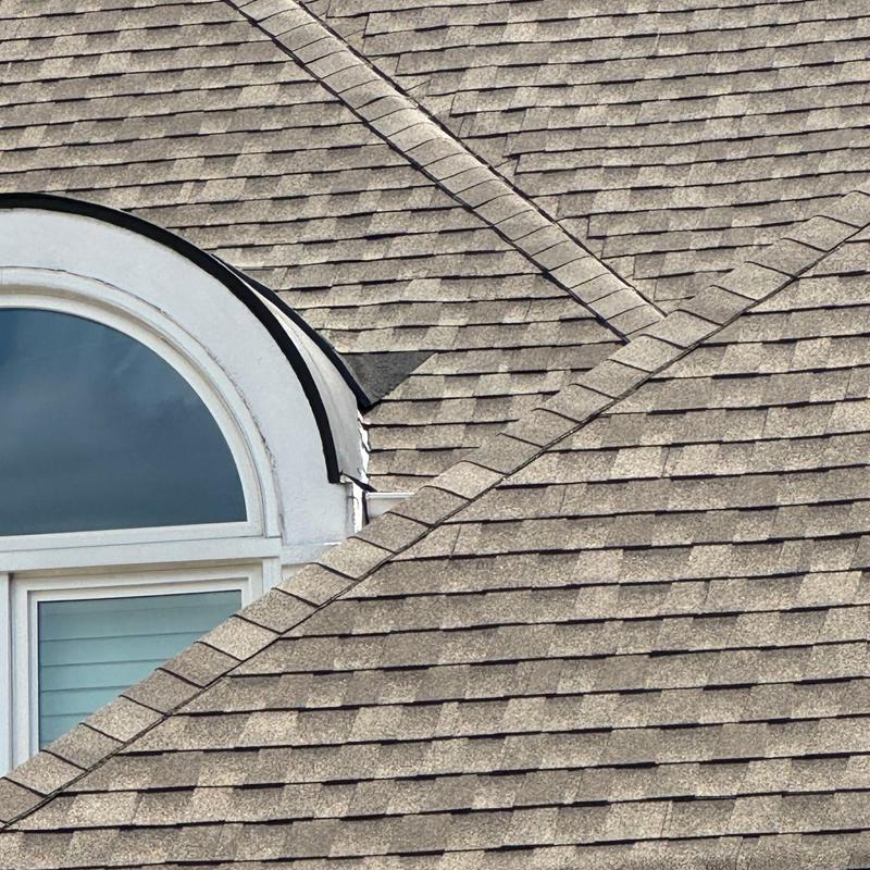 Architectural shingle roof with dormer window and flashing