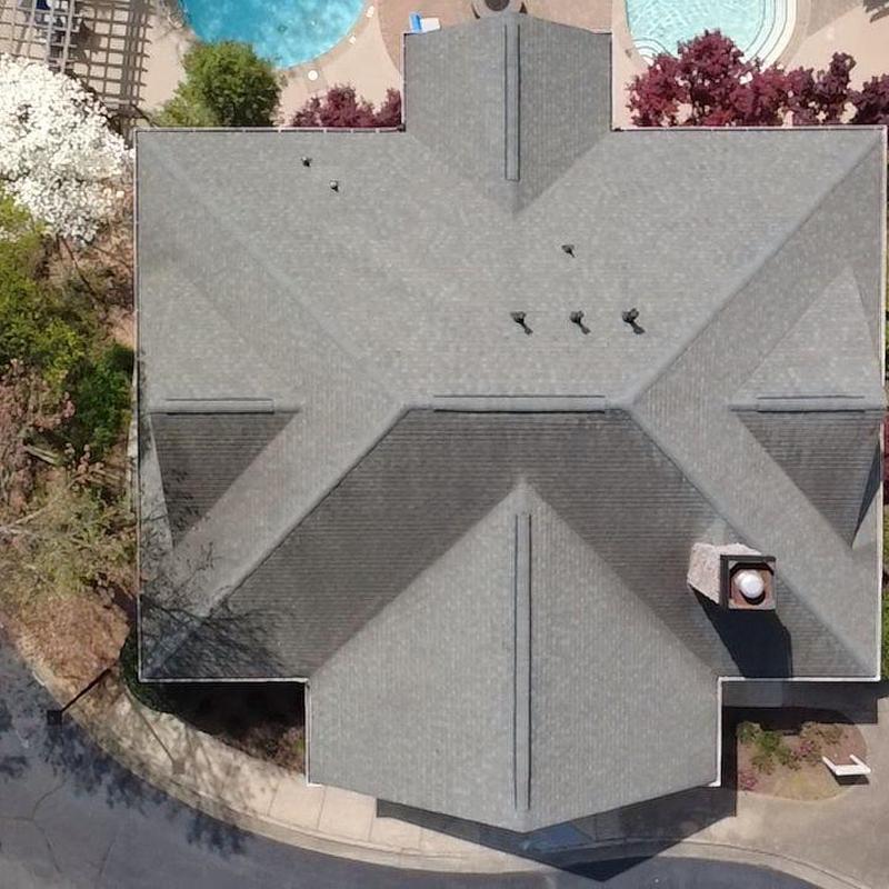 Apartment complex roof with new shingles and flashing