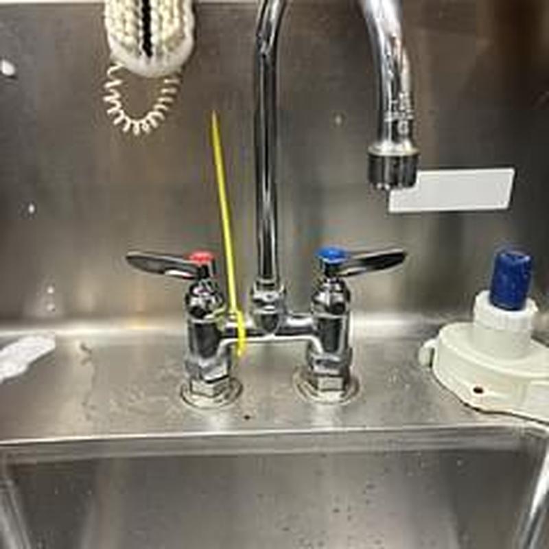 T&S commercial kitchen faucet with hot and cold handles