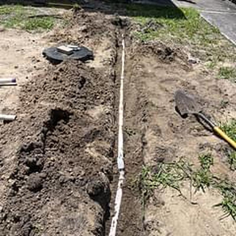 PVC laundry drain line trench excavation and repair