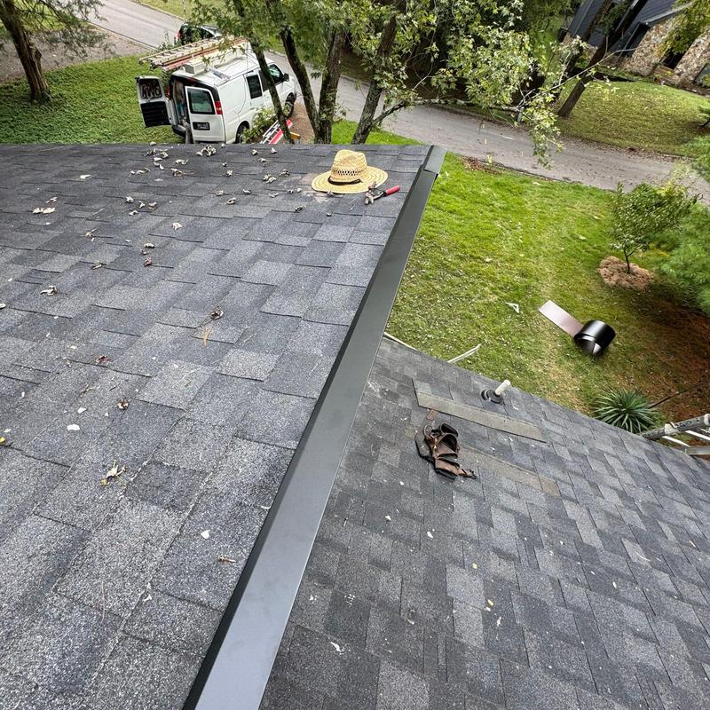 Asphalt shingle roof with ridge cap and tools