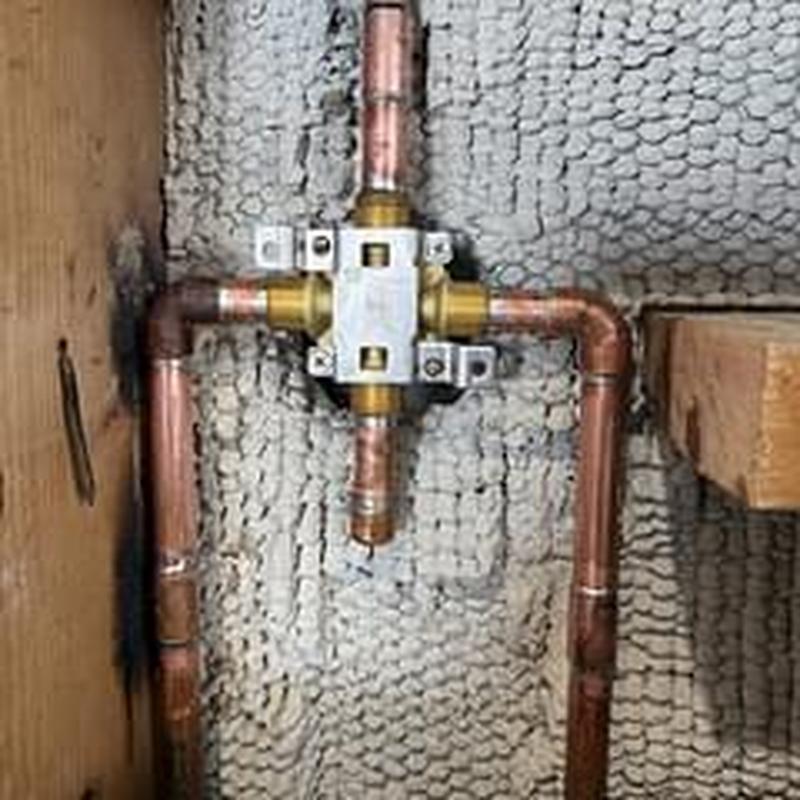 Copper shower valve with connected plumbing pipes