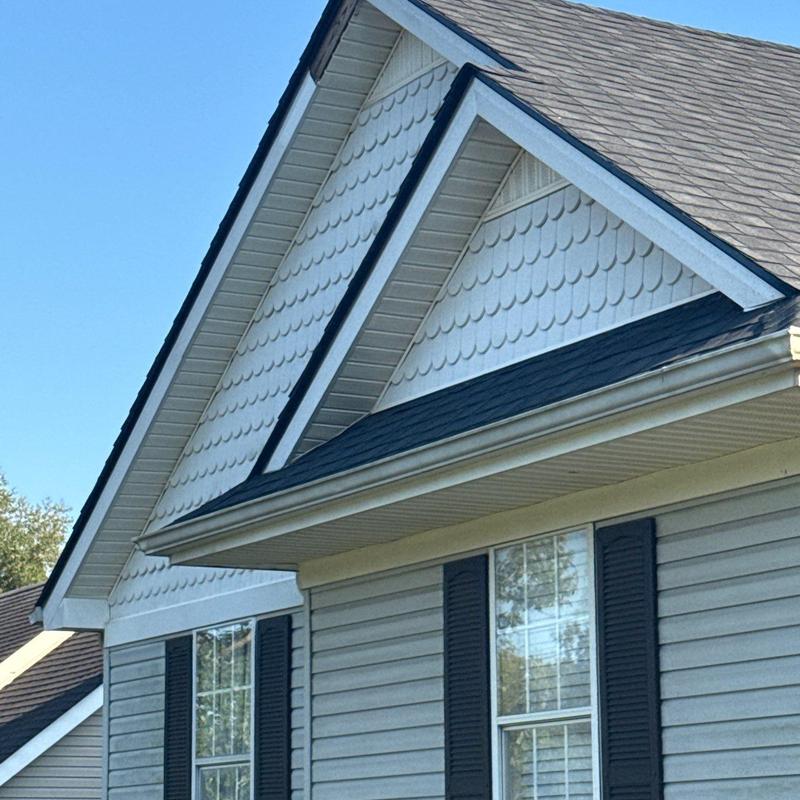 Roof shingles with hail damage and granule loss