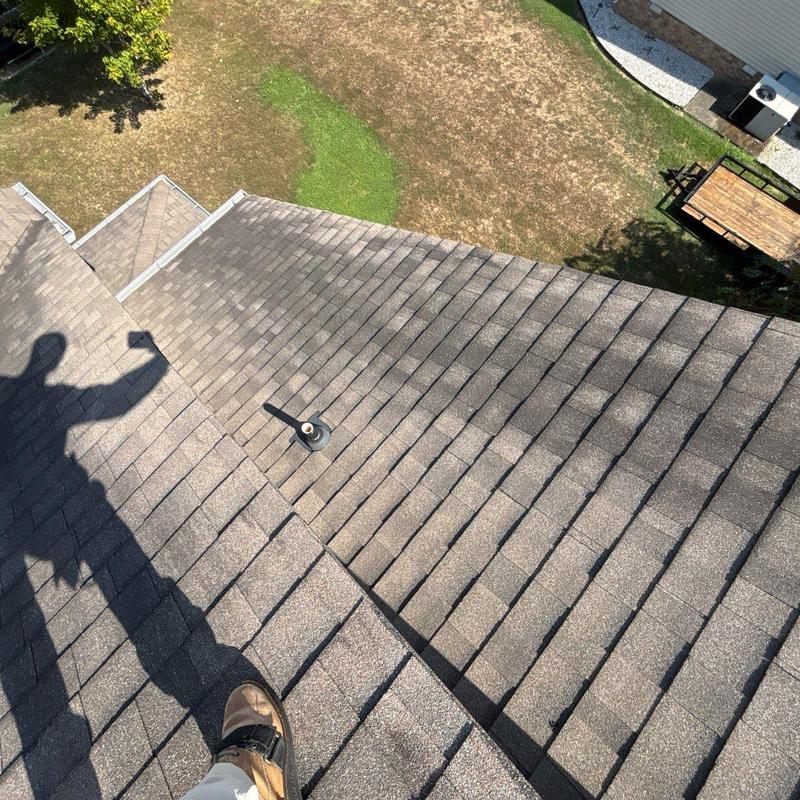 Asphalt shingle roof inspection showing hail damage