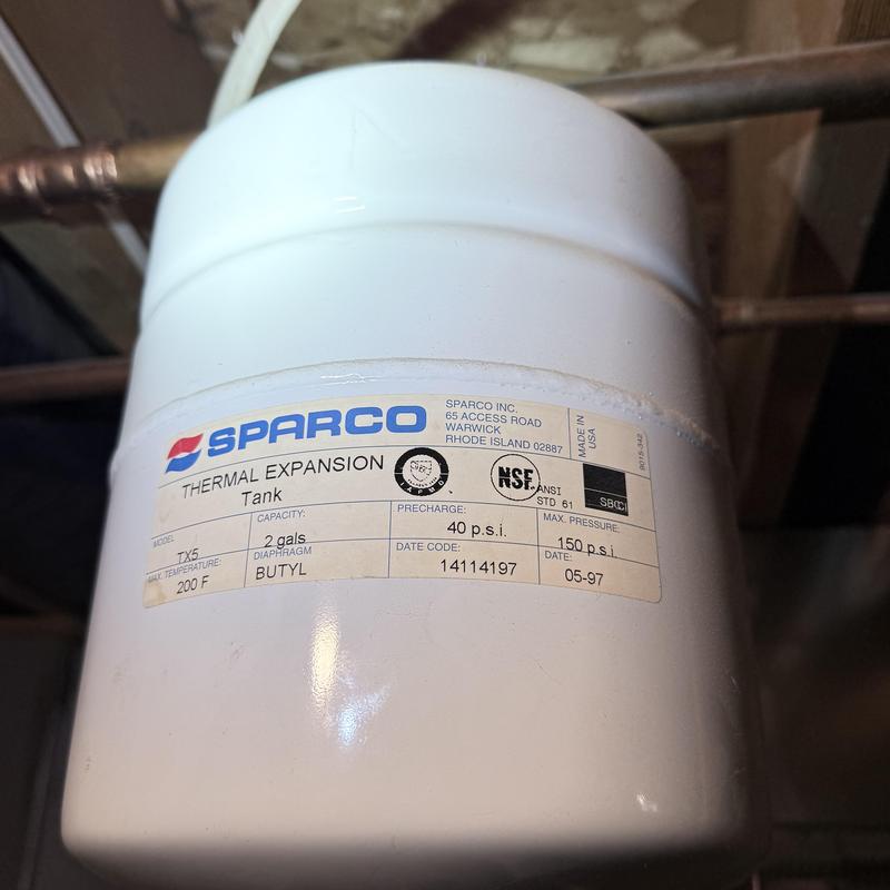 Water heater expansion tank close-up with label