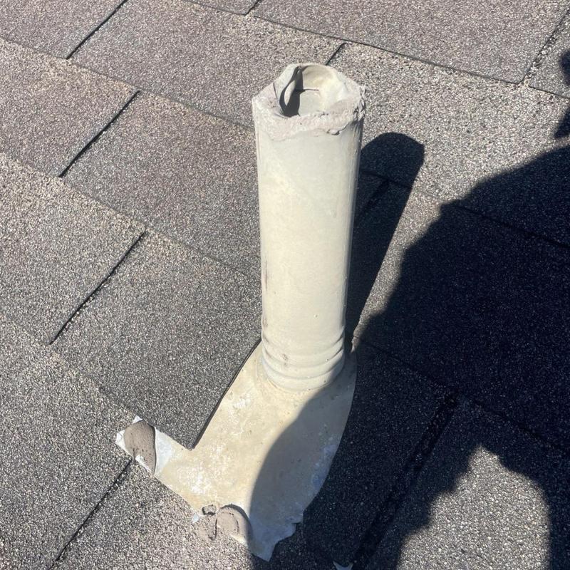 Deteriorated plumbing vent boot on roof shingles