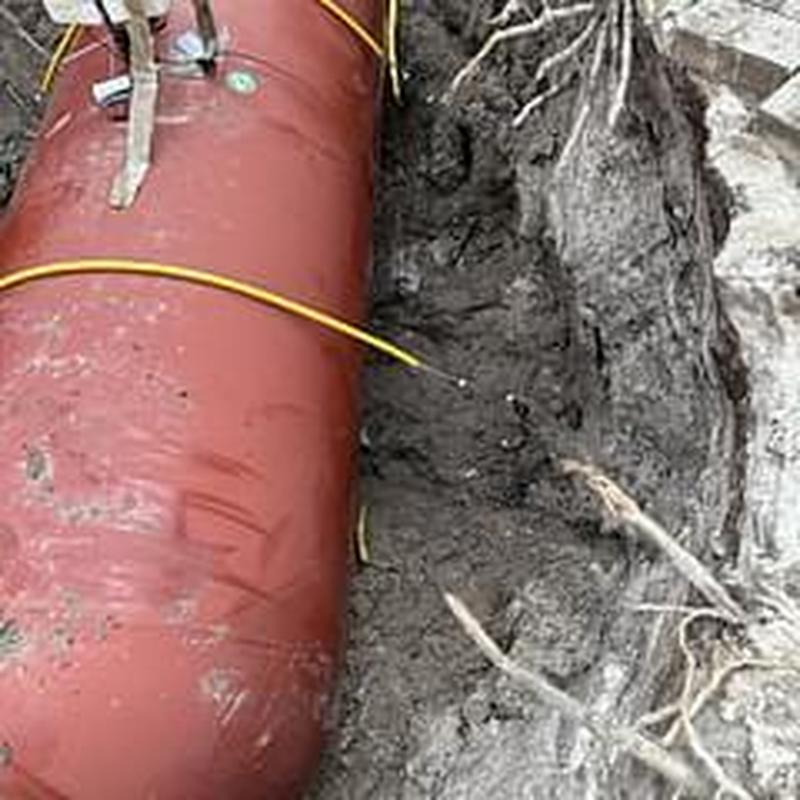 500-gal underground LP gas tank installation in driveway
