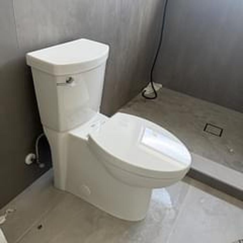 Toilet fixture installation in home remodel bathroom