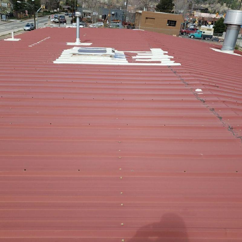 Metal roof with screws and pipe penetrations Metal roof with screws and pipe penetrations