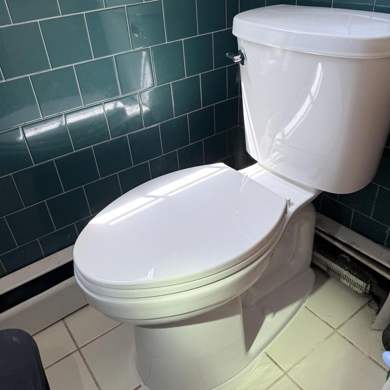 Toilet with new shut off valve installed in bathroom