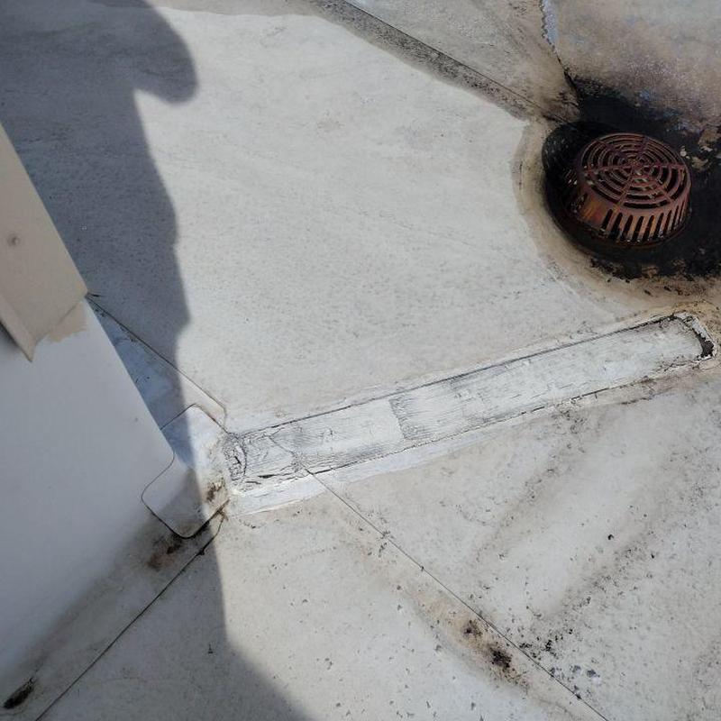 TPO roof seam and pipe jack showing repairs needed