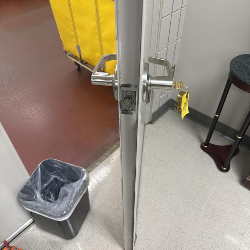 Lever lock with key cylinder rekeyed on commercial door