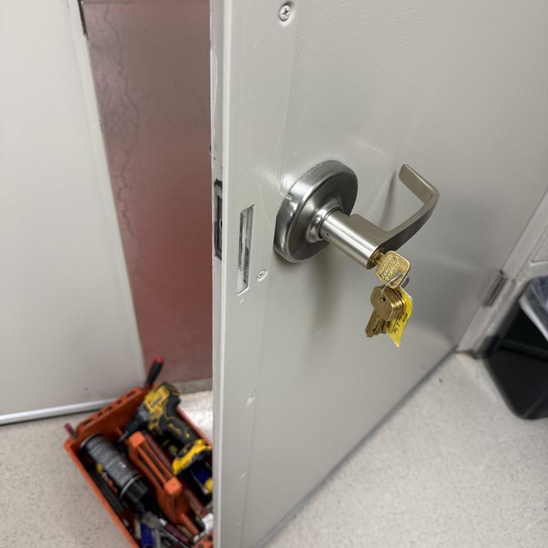 Lever lock with key cylinder rekeyed, commercial door