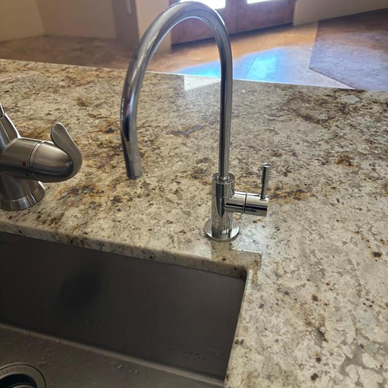 RO faucet on granite countertop in kitchen sink area