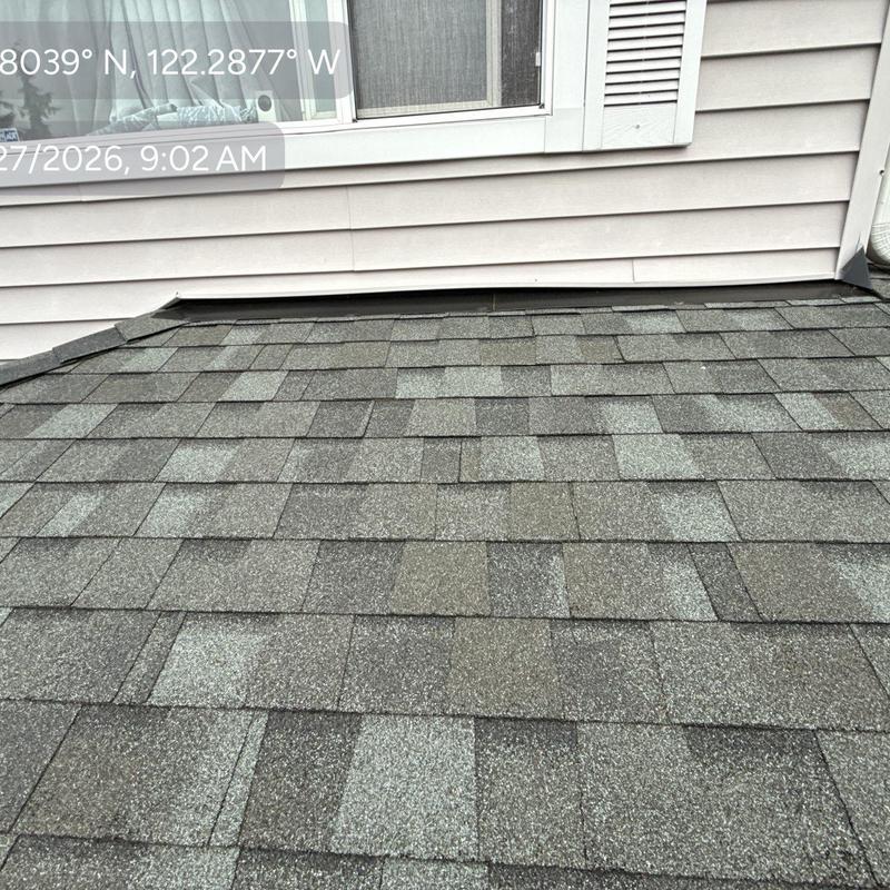 Asphalt roof shingles inspection near wall siding