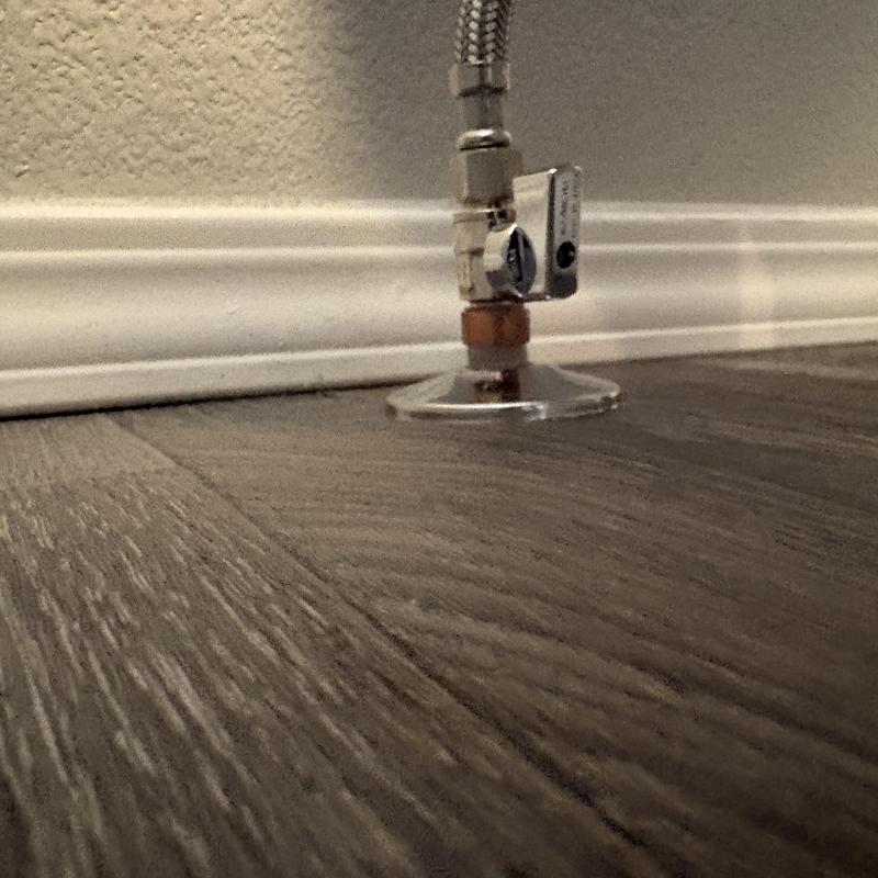 PEX piping valve and fitting installation by baseboard