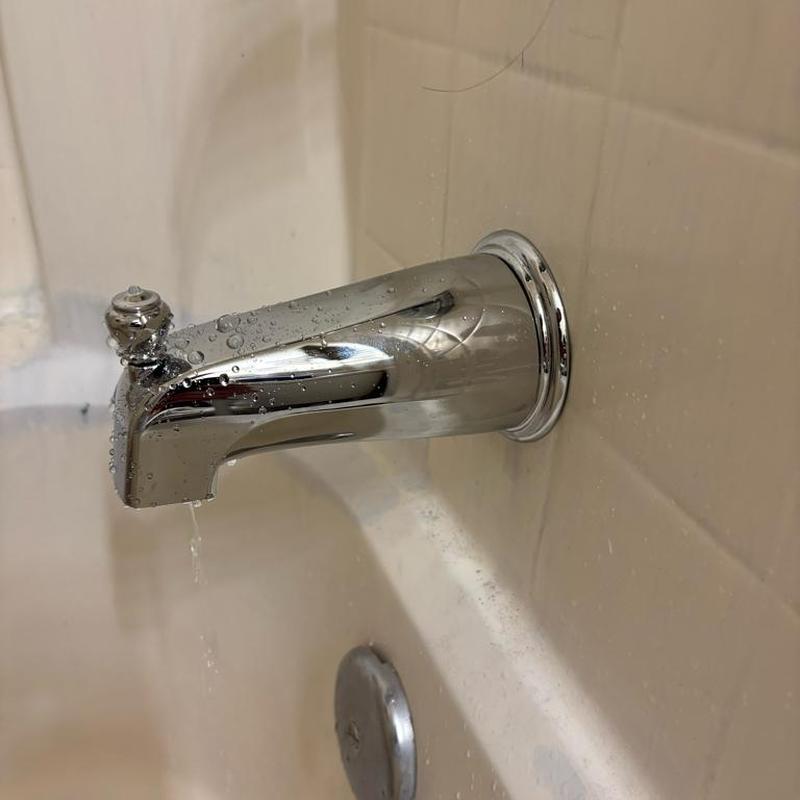 Moen slip style chrome tub spout installed with sealant