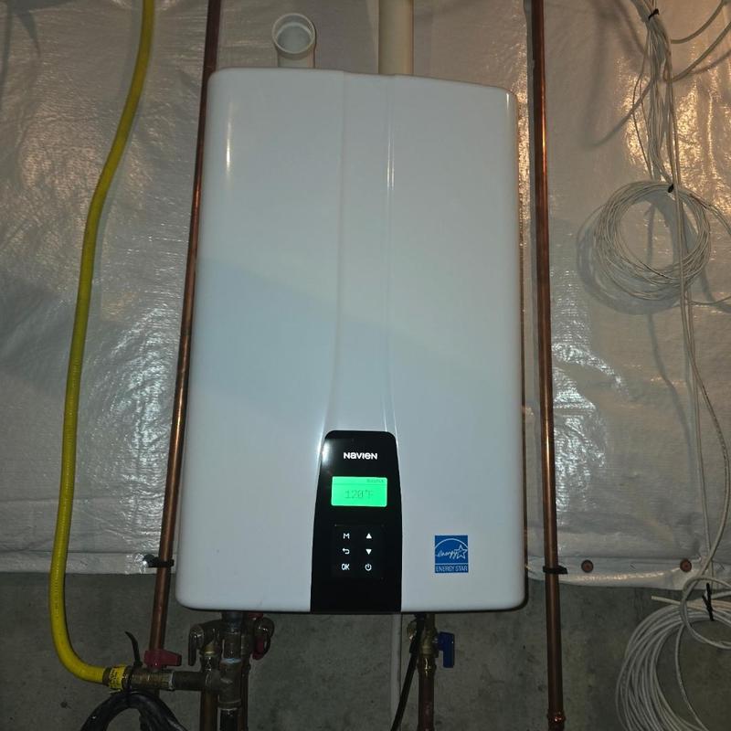 Tankless water heater with maintenance in basement