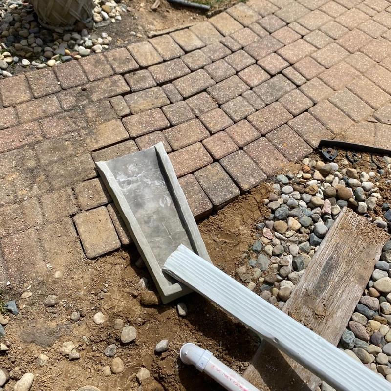 Window well drain with connected downspout extension