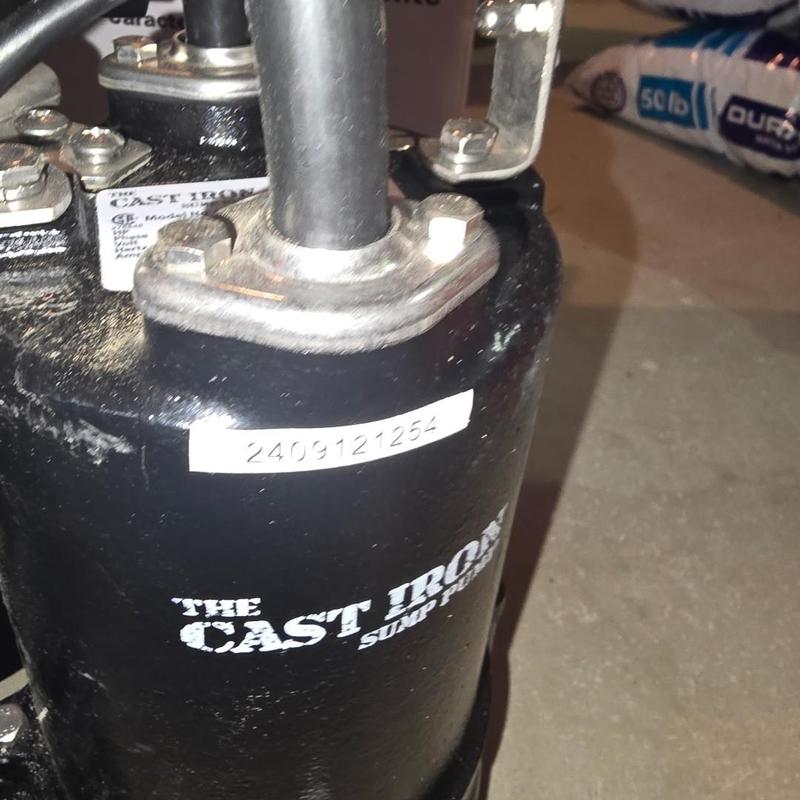 Cast iron sump pump with piping installation