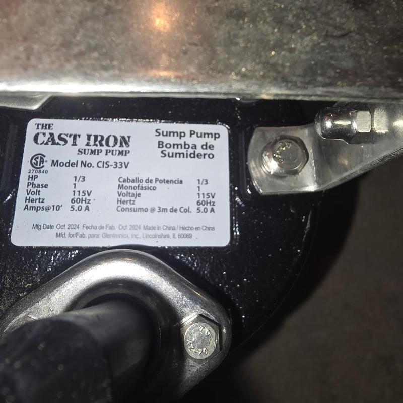 Cast Iron sump pump label and mounting bracket close-up