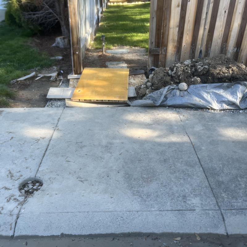 Water main excavation with soil and wooden cover