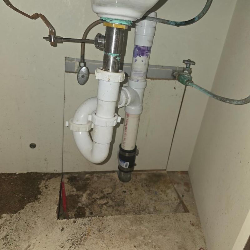 PVC drain and pop-up assembly installation under sink