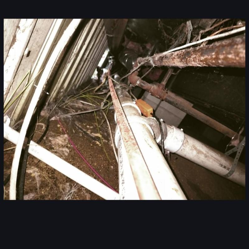 Copper pipe leak repair with surrounding plumbing lines