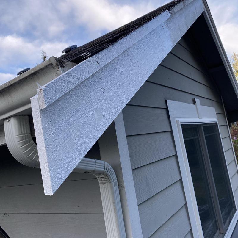 Fascia board and pipe boots on roof edge