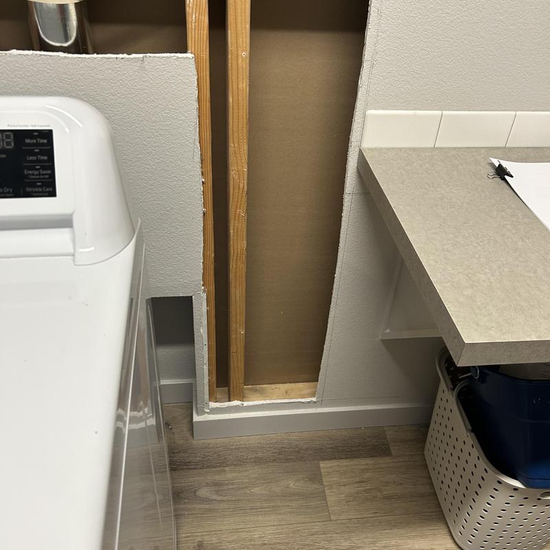 Laundry room wall opened for utility sink installation options