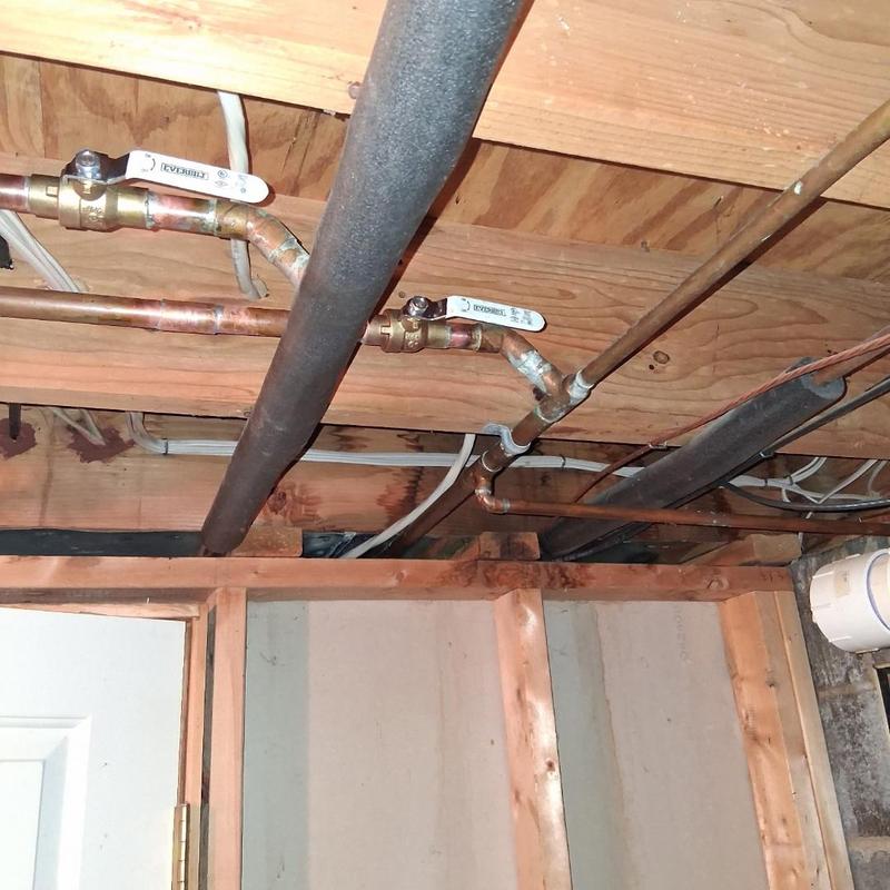 Copper water valves and silcock installation in basement ceiling