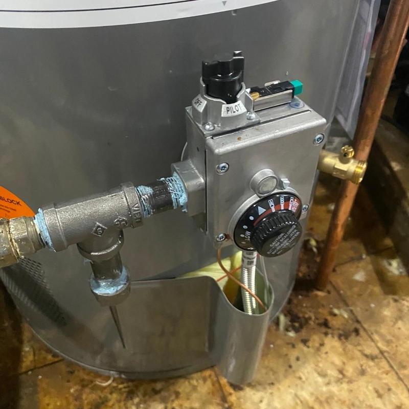 Water heater gas control valve and sediment trap installed