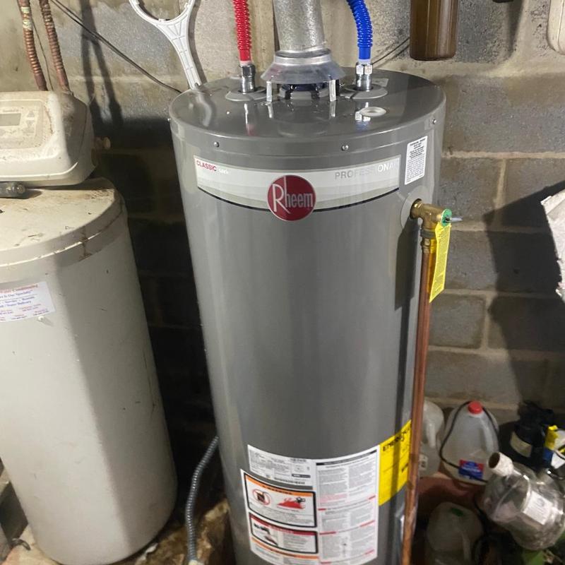 Water heater with new ball valve and gas tee installed
