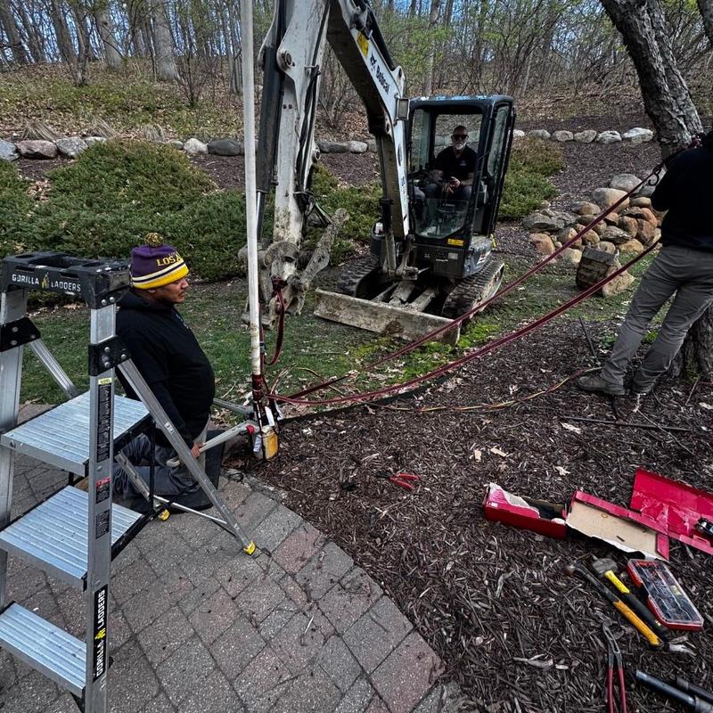 Well pump installation with excavation and wiring setup