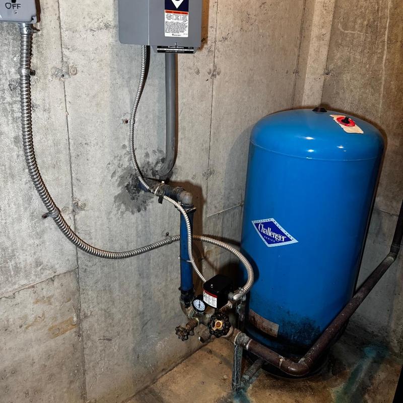 Bladder tank and pressure gauge in basement system