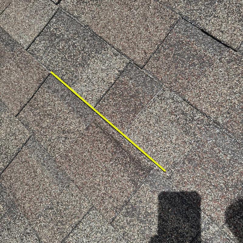 Owens Corning Oakridge asphalt shingles close-up with nail line Owens Corning Oakridge asphalt shingles close-up with nail line